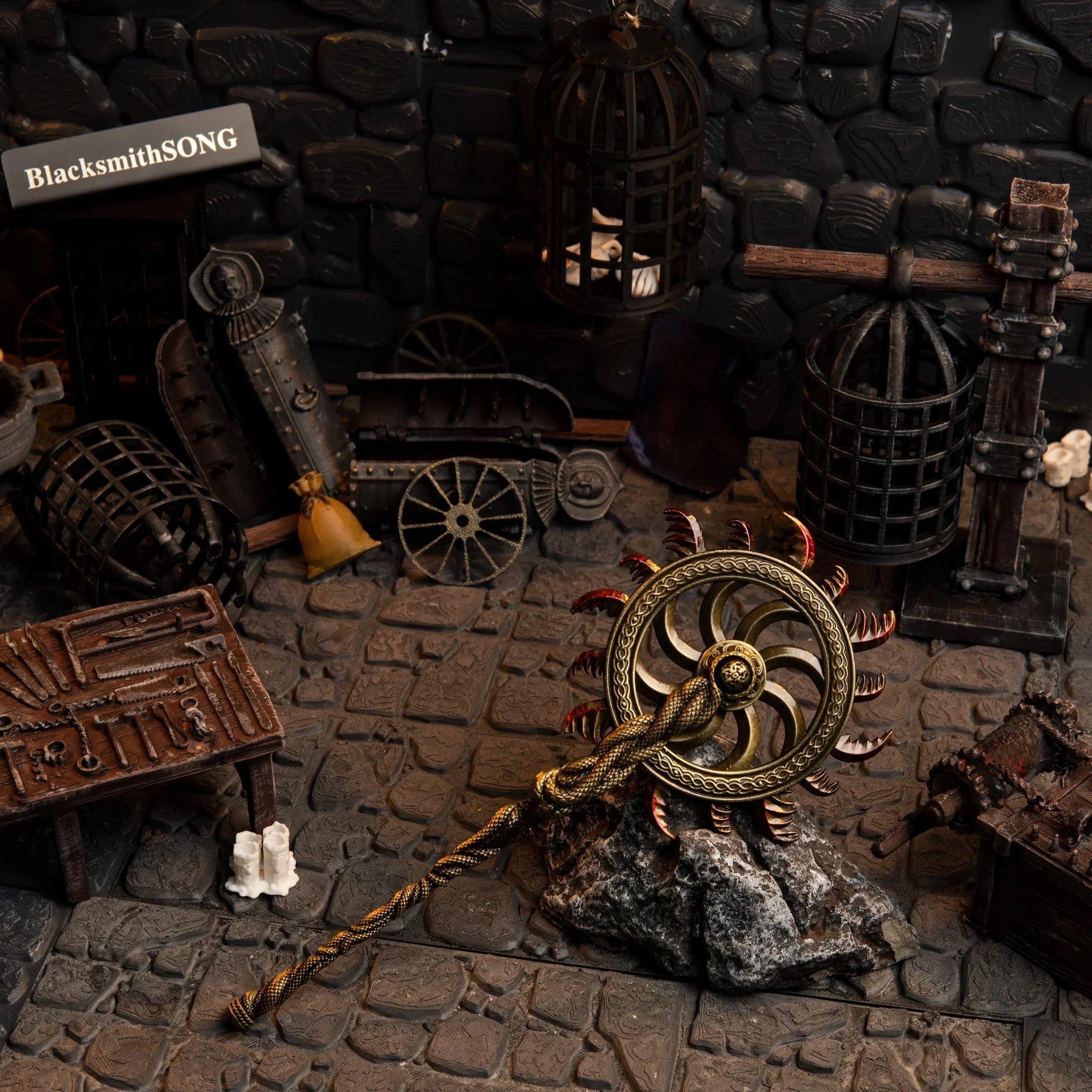 Ghiza's Wheel replica (20cm die-cast zinc alloy wheel) — hero shot in a handcrafted torture-chamber diorama, by BlacksmithSONG.