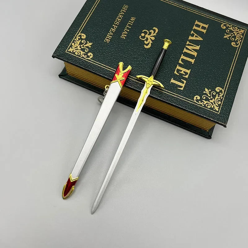 Anime-style 1:6 zinc alloy sword replica with red and gold details beside hardcover Hamlet book