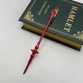 Red anime-style zinc alloy spear replica on Hamlet book, collectible display weapon