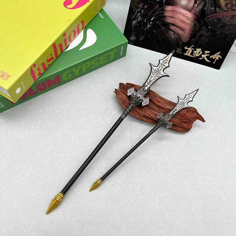 Two anime-style zinc alloy weapon replicas on a wooden stand, collectible display.