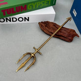 Anime-style zinc alloy trident replica on display with books and wood, BlacksmithSONG collectible