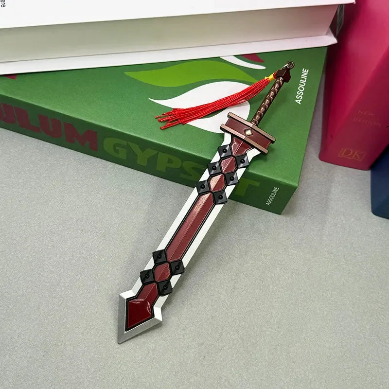 1:6 anime-style zinc alloy sword replica with red and black design on a desk near books