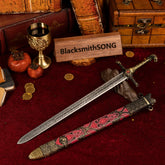 Oathkeeper metal sword replica unsheathed on a red velvet background, surrounded by vintage books, gold coins, and a golden goblet.