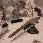 God of War Ingrid metal replica sword displayed in a gothic ruins diorama with white sand and amethyst, by BlacksmithSONG.