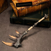 Fatalis Zaggespanon replica (27cm die-cast zinc alloy long sword) — three-horn head on stacked books, by BlacksmithSONG.