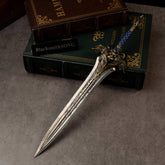 Lion's Fang replica (30cm die-cast zinc alloy greatsword) — hero shot on a stack of books, by BlacksmithSONG.