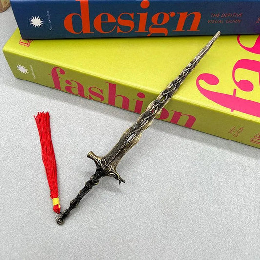 Anime-style zinc alloy sword replica with red tassel on table, BlacksmithSONG collectible.