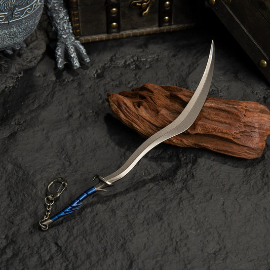 Anime-style 1:6 zinc alloy curved sword keychain collectible on dark stone with wood decor