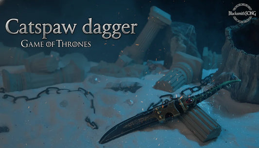 Catspaw dagger replica from Game of Thrones on sand with broken columns, BlacksmithSONG display.