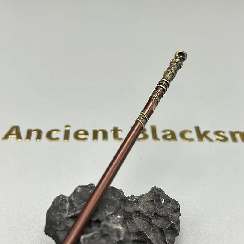 Anime-style zinc alloy weapon replica staff on rock display, collectible from BlacksmithSONG