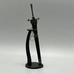 Anime-style black zinc alloy sword replica on display stand with keychain accessory