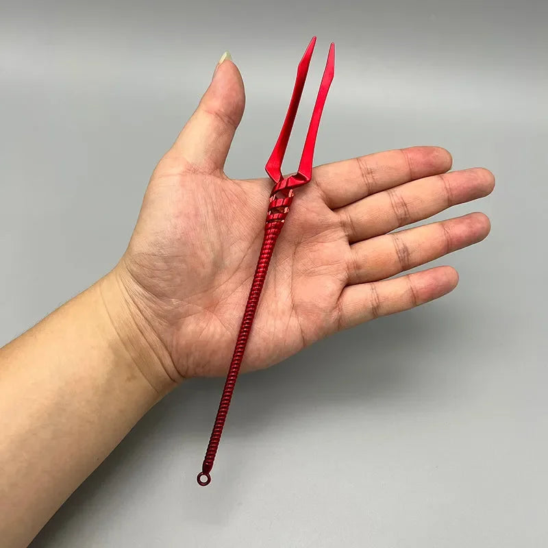 Hand holding red 1:6 anime-style zinc alloy trident replica collectible by BlacksmithSONG