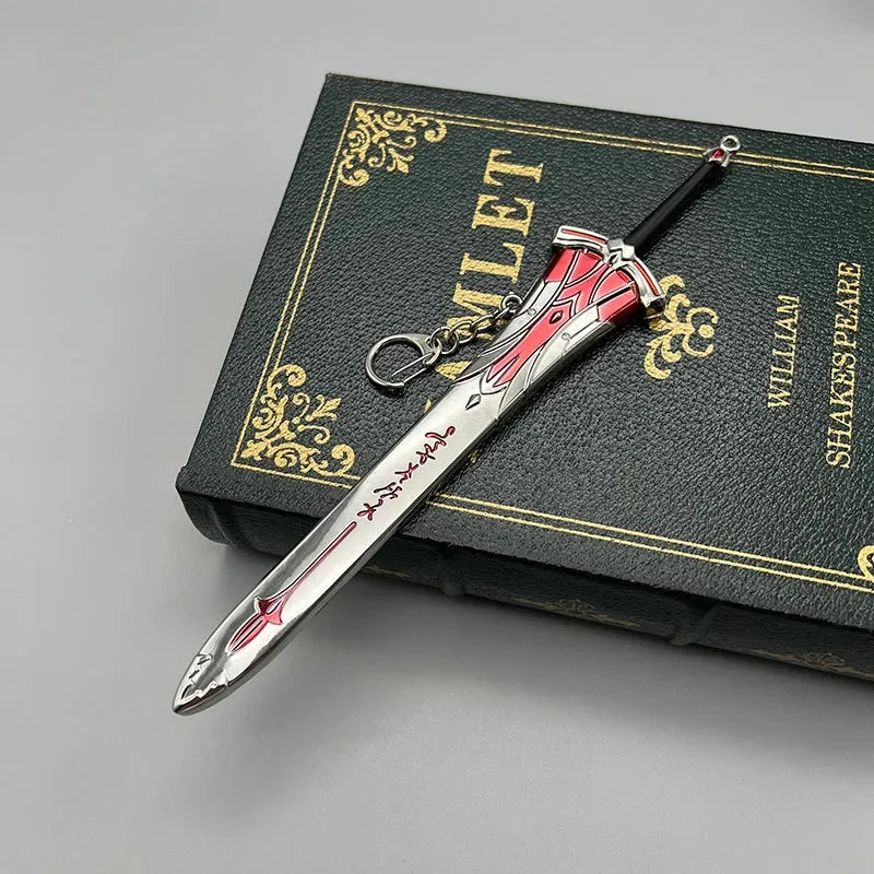 1:6 anime-style zinc alloy sword keychain collectible with red accents on a Hamlet book