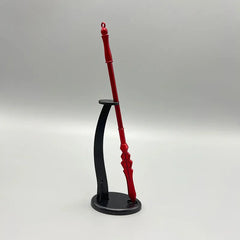 Red 1:6 anime-style zinc alloy weapon replica on black display stand, collectible cosplay prop
