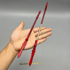 Hand holding two red 1:6 anime-style zinc alloy weapon replicas from BlacksmithSONG.