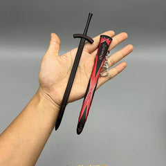 Hand holding BlacksmithSONG 1:6 anime-style black zinc alloy sword replica with red sheath keychain