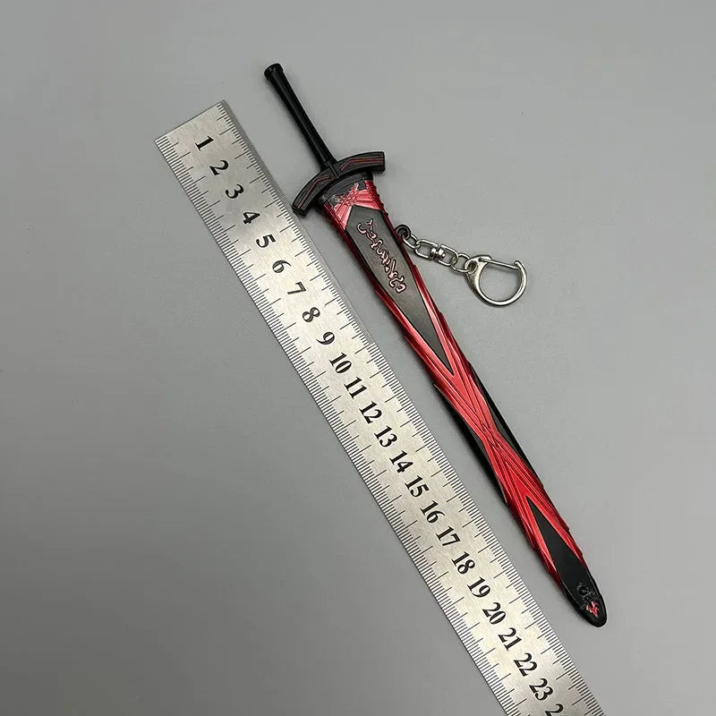 Anime-style zinc alloy sword keychain collectible with red and black details beside a ruler