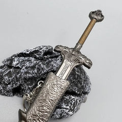 Anime-style zinc alloy sword replica collectible on textured stone, BlacksmithSONG display.
