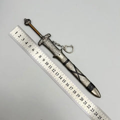 Anime-style zinc alloy sword keychain collectible with ornate handle beside a ruler, BlacksmithSONG.