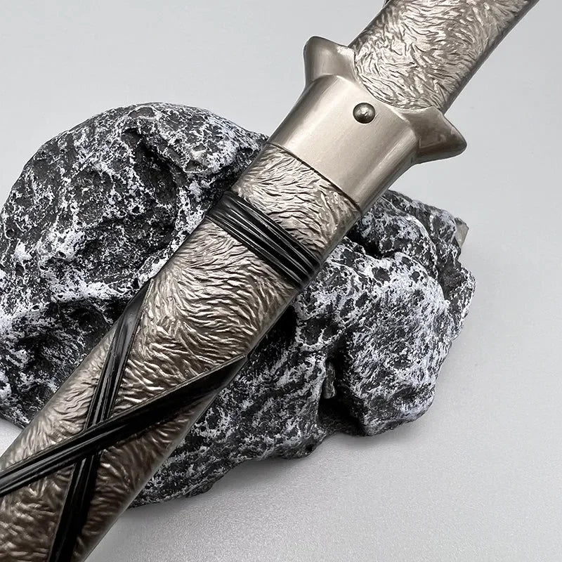 1:6 scale anime-style zinc alloy sword replica with textured handle on stone, BlacksmithSONG collectible.