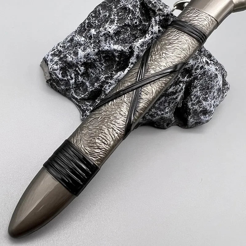 1:6 scale anime-style zinc alloy weapon replica with textured handle on stone, collectible display