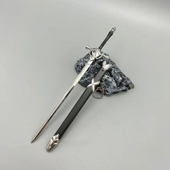1:6 anime-style zinc alloy sword replica with sheath displayed on stone, collectible from BlacksmithSONG