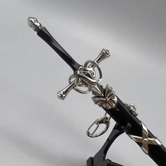 Anime-style zinc alloy sword replica with black and silver detailing on display stand