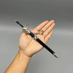 Hand holding BlacksmithSONG 1:6 zinc alloy anime sword replica with keychain for cosplay