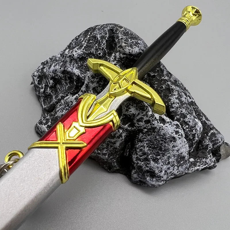 Anime-style zinc alloy collectible sword replica with gold, red, and black details on a stone base