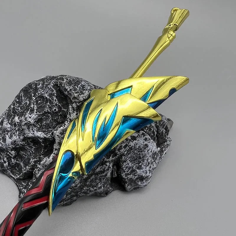 Anime-style 1:6 zinc alloy sword replica with gold and blue details on a stone display