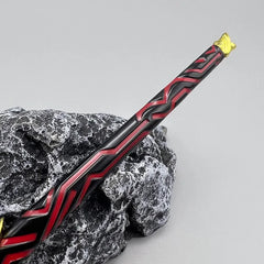 1:6 anime-style black and red zinc alloy sword replica on a textured rock, collectible display