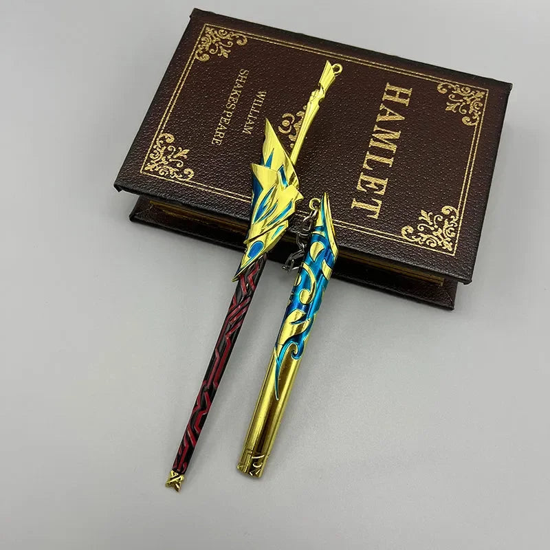 Colorful zinc alloy anime-style sword replicas on a Hamlet book, BlacksmithSONG collectible.
