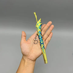 Hand holding 1:6 scale anime-style yellow and blue zinc alloy sword replica keychain