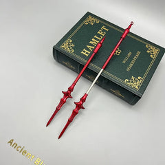 Red anime-style zinc alloy weapon replicas on Hamlet book, BlacksmithSONG collectible display