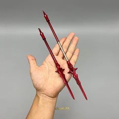 Hand holding two red 1:6 anime-style zinc alloy weapon replicas from BlacksmithSONG