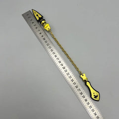Anime-style zinc alloy weapon replica with gold chain beside ruler, collectible display.