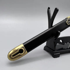 Anime-style zinc alloy sword replica with black sheath and gold tip on display stand