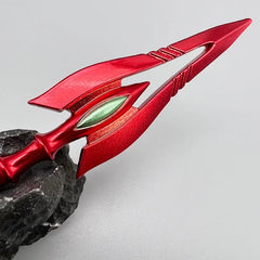 Red anime-style zinc alloy spear replica on rock, collectible display from BlacksmithSONG