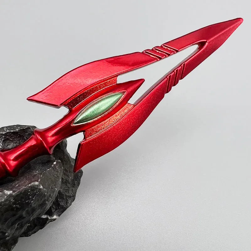 Red anime-style zinc alloy spear replica on rock, collectible display from BlacksmithSONG