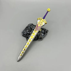 Anime-style zinc alloy sword replica with gold, yellow, and purple details on a stone display