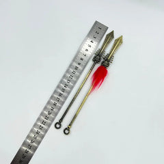 1:6 scale anime-style zinc alloy spear replica with red tassel beside ruler, collectible for cosplay and display