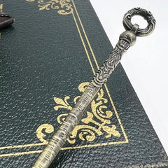 1:6 scale anime-style zinc alloy weapon replica with ornate handle on decorative book cover