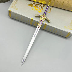 Anime-style zinc alloy sword replica with gold and purple accents on a book, BlacksmithSONG collectible.