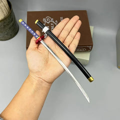 Hand holding a 1:6 anime-style zinc alloy katana replica with black sheath and purple handle
