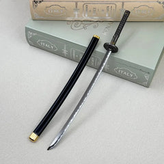 1:6 anime-style zinc alloy katana replica with black scabbard, displayed on books
