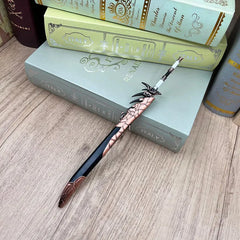 Anime-style zinc alloy sword replica with intricate design on wood surface, books in background