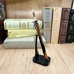 Anime-style 1:6 zinc alloy weapon replica on stand, displayed with books, BlacksmithSONG collectible.