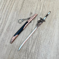 Anime-style zinc alloy sword replica with dragon details and sheath on wood surface, BlacksmithSONG collectible.