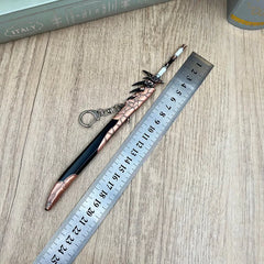 1:6 anime-style zinc alloy sword keychain replica with ruler on wood surface, BlacksmithSONG collectible.