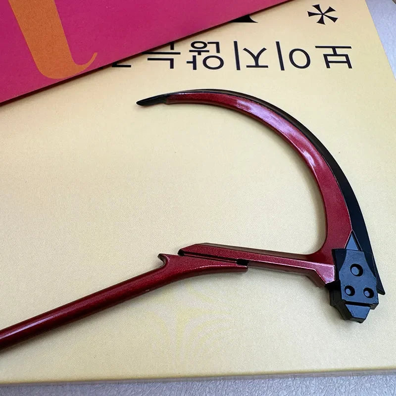 Red and black anime-style zinc alloy scythe replica collectible, displayed on a flat surface